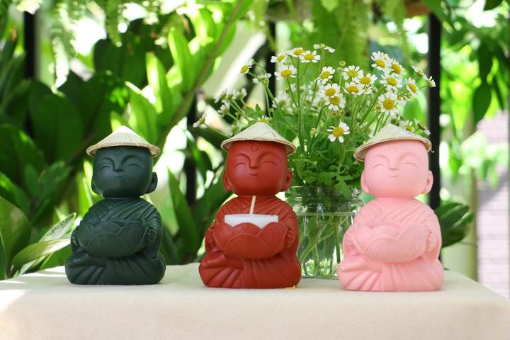 Sitting Buddha with candle holder